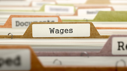 Wages label sticking out from a brown folder