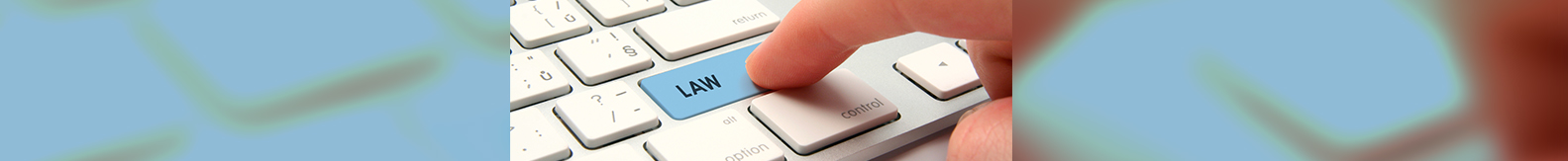 Finger pressing "LAW" key on keyboard